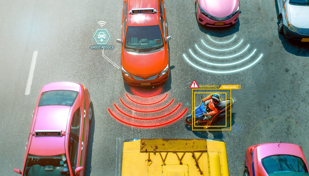 Graphic of several cars driving on a road with various cars via illustrations showing the technology that is keeping the drivers safe.