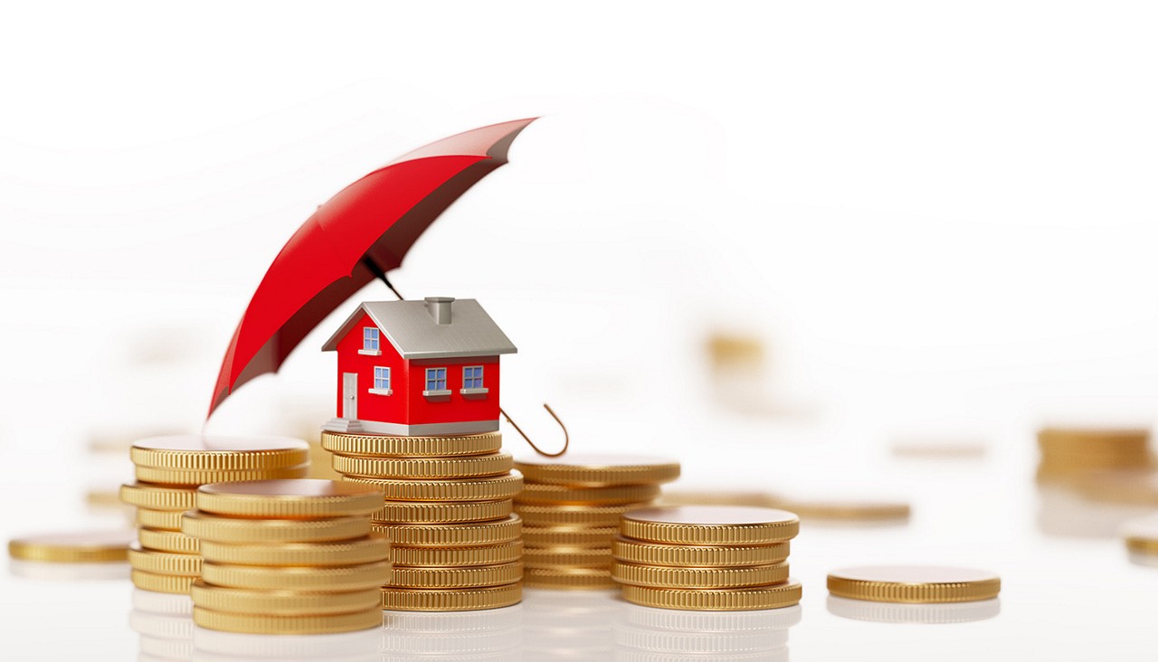 A graphic image of a red house on top of stacks of coins with a red umbrella over the house.