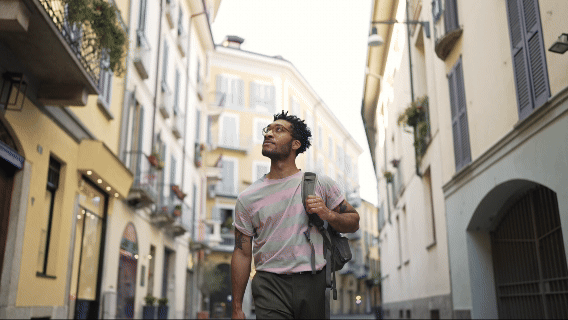 man touring a European city block