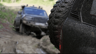 Vehicle being towed by another vehicle.