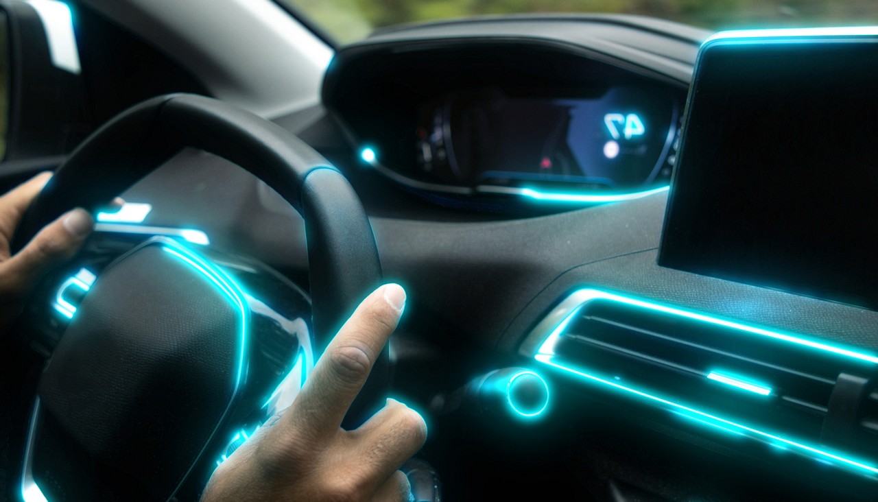 Driving a futuristic car interior with glowing blue light