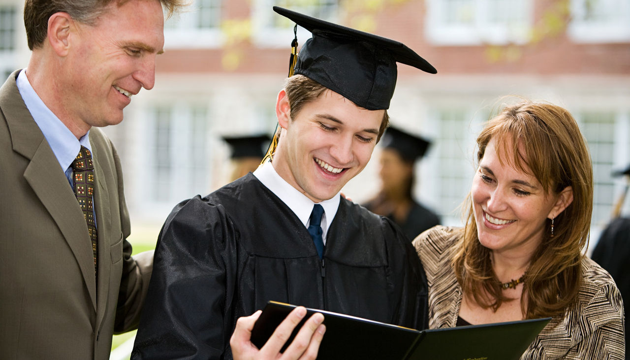 Graduation: Proud Family Admires Diploma