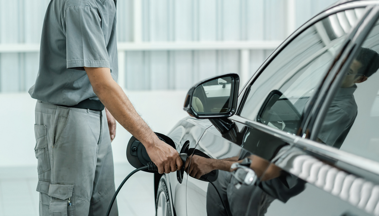 Man charging his electric vehicle