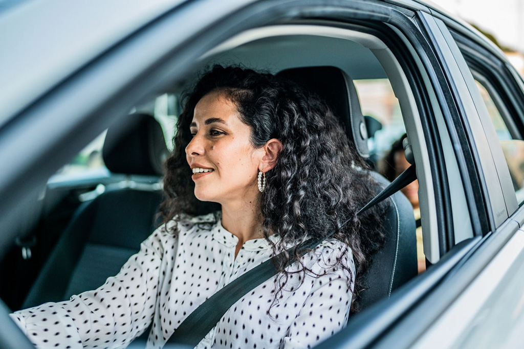 Woman driving a new car